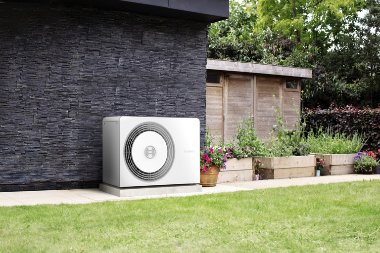 Bosch air-to-water heat pump by the house — state support for a heat pump 2026